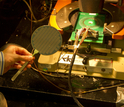 a basic carbon nanotube computer sandwiched beneath a probe card.